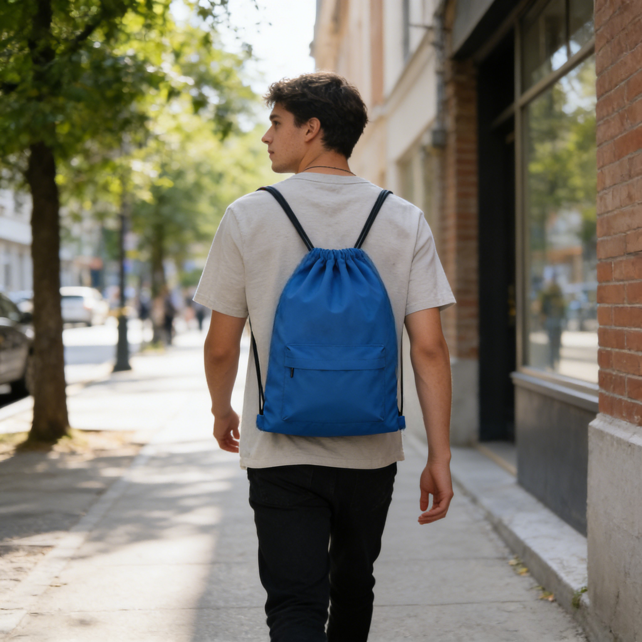 Waterproof RPET drawstring backpack in use during outdoor hiking and travel