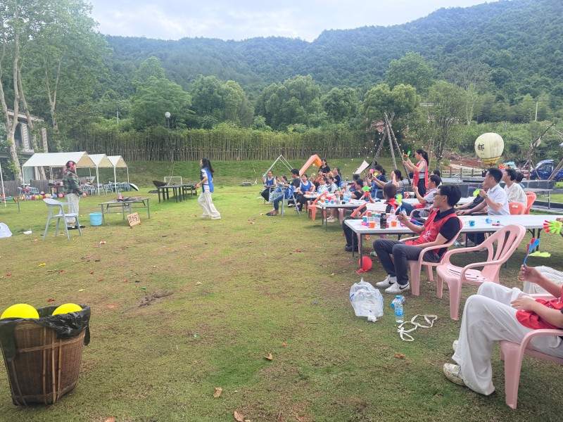 Weihuang Textile employees celebrating with awards during team building ceremony